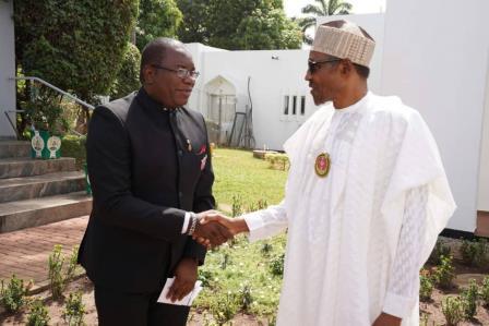 Kole in handshake with President Buhari